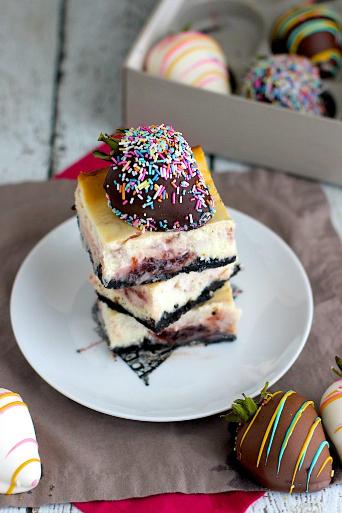 chocolate cheesecake bars and strawberries